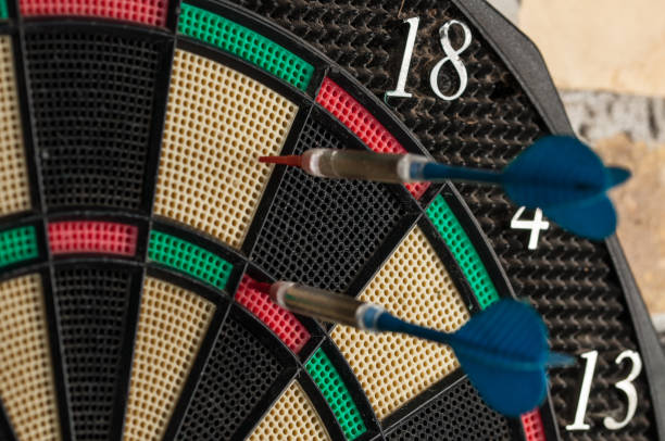 istock Red and blue dart arrrow hitting in the target.Darts sport concept. 1219032432
