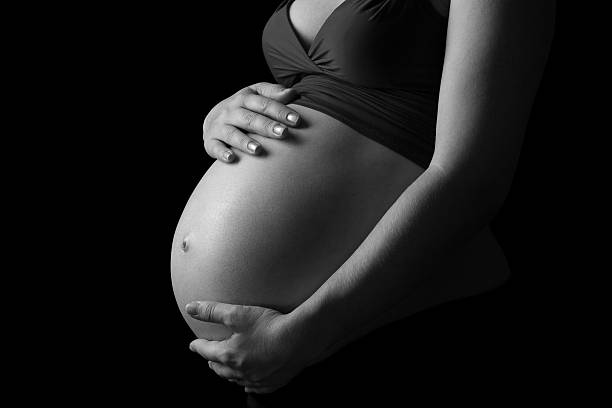 Pregnant woman black and white stock photo