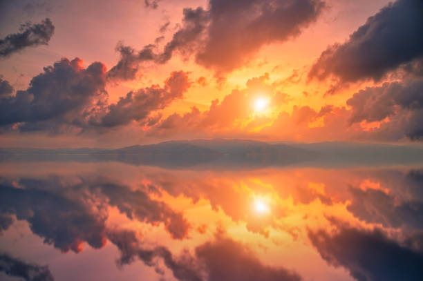 istock Colorful sunset with dramatic sky background over sea. 1219033310