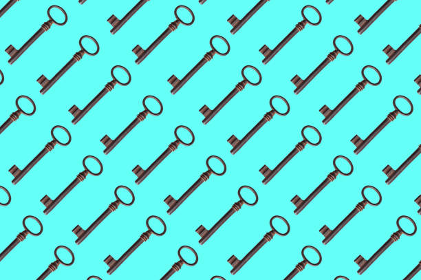 pattern of old rusty keys on a blue background. the key is repeated many times