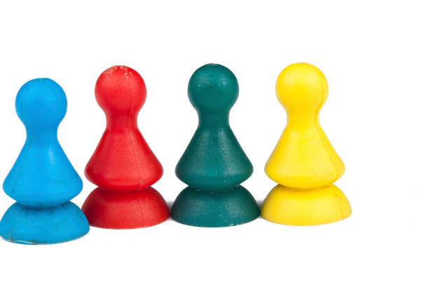 istock Colorful play figures with dice isolated on white background.Copy space. 1219034276
