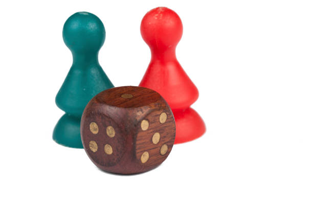 istock Colorful play figures with dice isolated on white background.Copy space. 1219034361