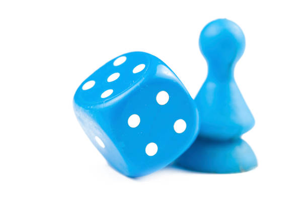 istock Colorful play figures with dice isolated on white background.Copy space. 1219034884