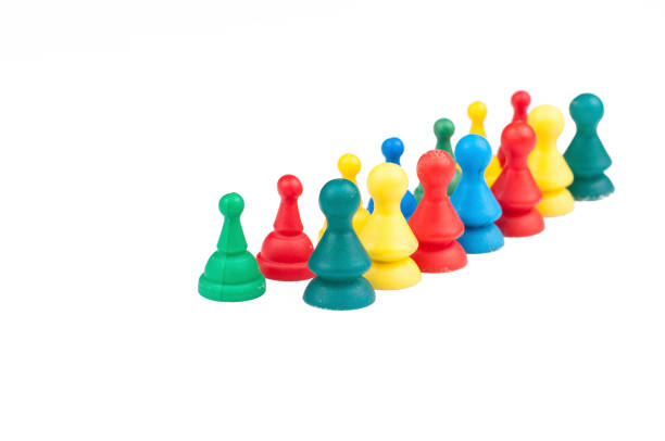 istock Colorful play figures with dice isolated on white background.Copy space. 1219034941