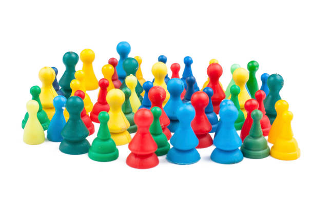 istock Colorful play figures with dice isolated on white background.Copy space. 1219034996
