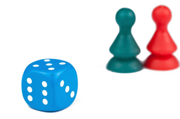 istock Colorful play figures with dice isolated on white background.Copy space. 1219035003
