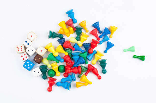 istock Colorful play figures with dice isolated on white background.Copy space. 1219035025