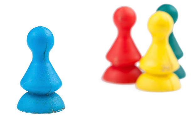 istock Colorful play figures with dice isolated on white background.Copy space. 1219035076