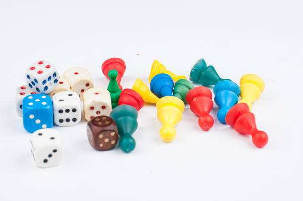 istock Colorful play figures with dice isolated on white background.Copy space. 1219035096