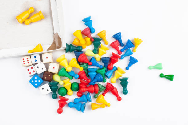 istock Colorful play figures with dice isolated on white background.Copy space. 1219035107