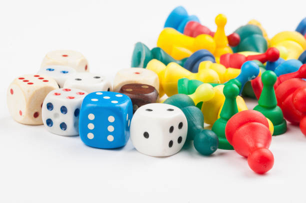 istock Colorful play figures with dice isolated on white background.Copy space. 1219035121