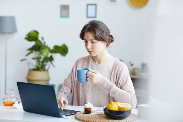 istock Woman working online at home 1219036344