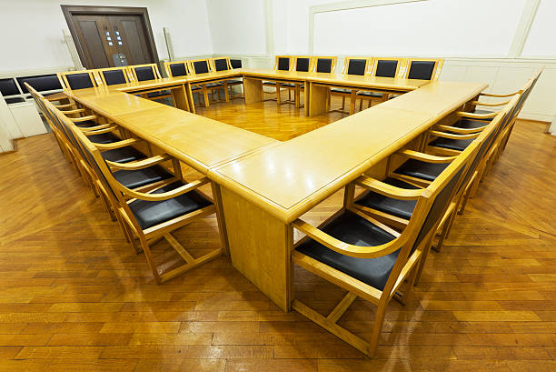 istock Modern conference room with wooden tables and chairs 121903762