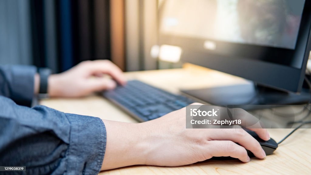 Holding computer mouse while using computer Male hand clicking computer mouse using desktop computer in furniture store. Interior material design simulation program for customer. Home improvement concept Computer Mouse Stock Photo Holding computer mouse while using computer Male hand clicking computer mouse using desktop computer in furniture store. Interior material design simulation program for customer. Home improvement concept Computer Mouse Stock Photo