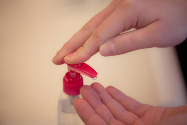 istock Applying hand gel sanitizer 1219039020