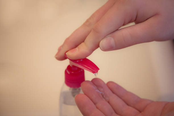 istock Applying hand gel sanitizer 1219039025