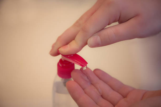 istock Applying hand gel sanitizer 1219039028