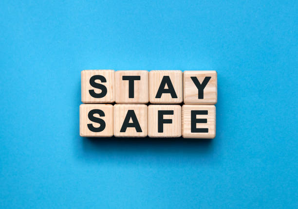 istock STAY SAFE - text on wooden cubes on a blue background 1219039477