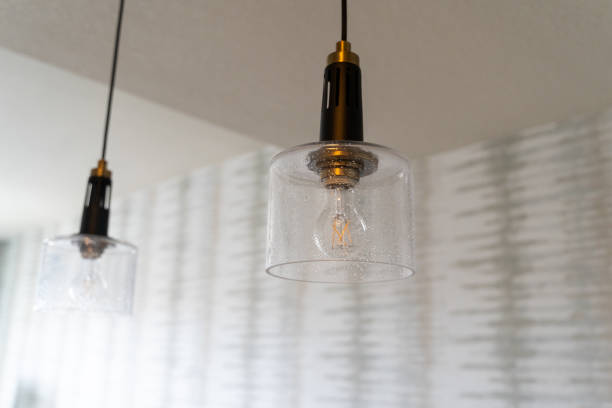 istock Modern looking kitchen hanging light fixtures inside a house features an exposed lightbulb 1219041537