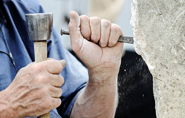 stone sculptor a stone carver at work sculpture stock pictures, royalty-free photos & images