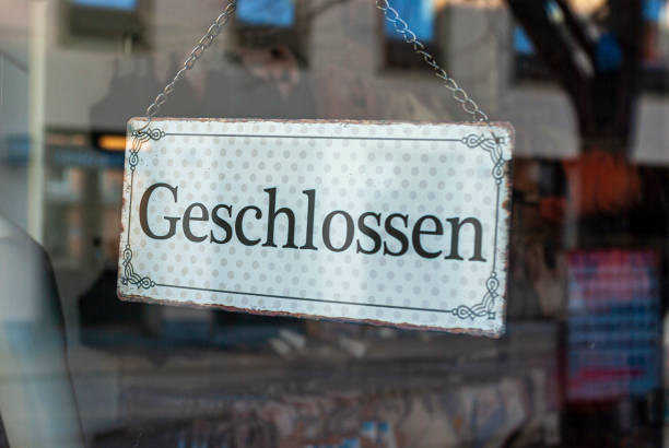 istock Closed Sign in Shop Window 1219042770