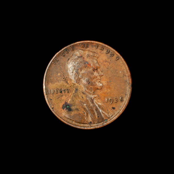 istock An old American penny on a black background 1219042872