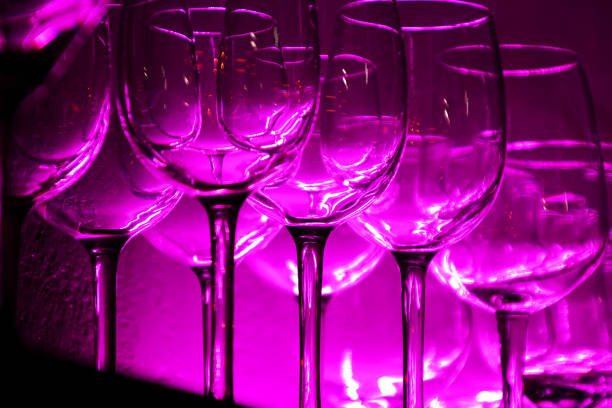istock 12 Wine glasses and glasses on a shelf in a bar 1219043066