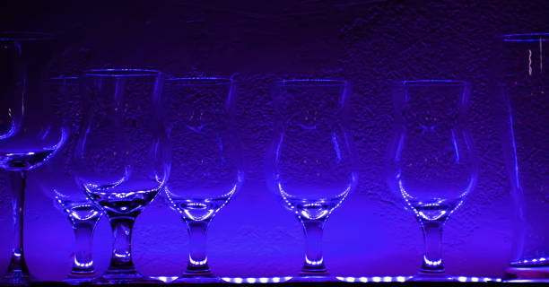istock 2 Wine glasses and glasses on a shelf in a bar 1219043097