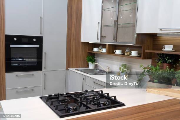 Modern Kitchen In White And Walnut Wood Interior House Stock Photo - Download Image Now