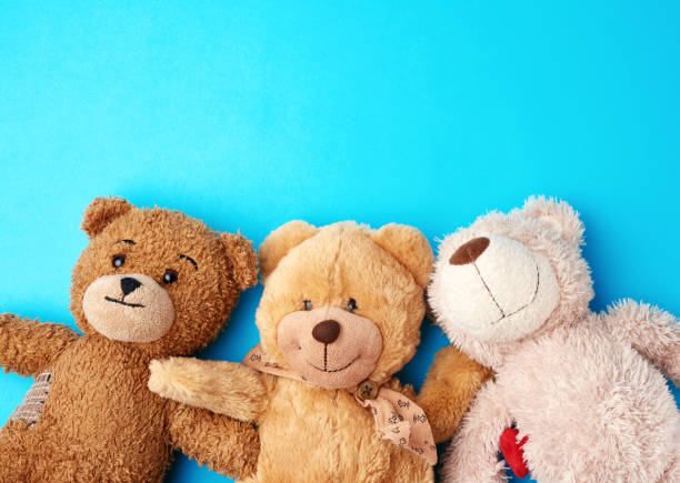 istock various teddy bears lie on a blue background head to head and look up 1219049174