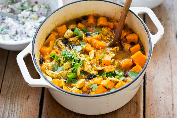 Chicken with cumin, turmeric and coriander with sweet potatoes Chicken with cumin, turmeric and coriander with sweet potatoes root vegetable stock pictures, royalty-free photos & images