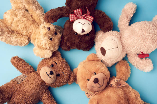 istock various teddy bears lie on a blue background head to head and look up 1219049317