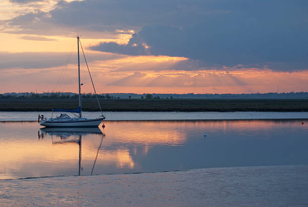 istock Sunset and sailing boat at Walton on the Naze 121905057