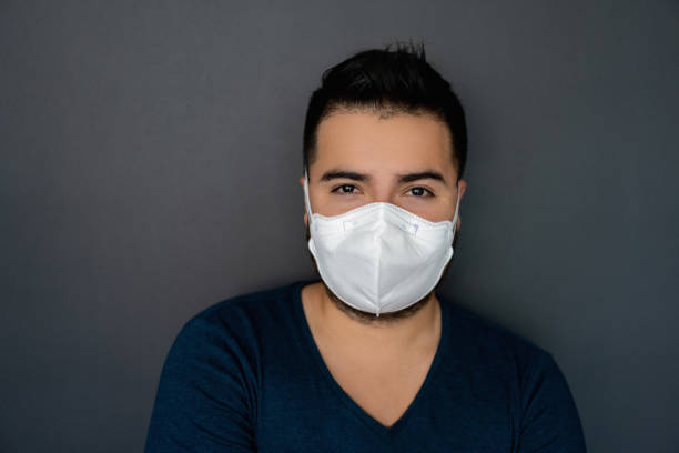 istock Portrait of a man wearing an N95 facemask 1219051815