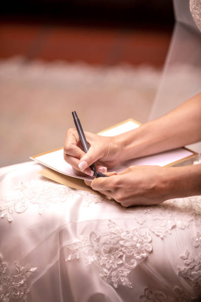 istock Bride to be writing her vows to her husband to be before the wedding ceremony 1219052419