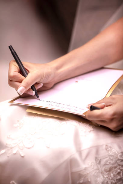 istock Bride to be writing her vows to her husband to be before the wedding ceremony 1219052424