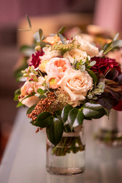 istock Red and white rose wedding bouqet in a vase with water 1219052521