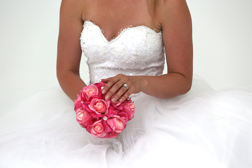 Bride holding a floral wedding bouquet