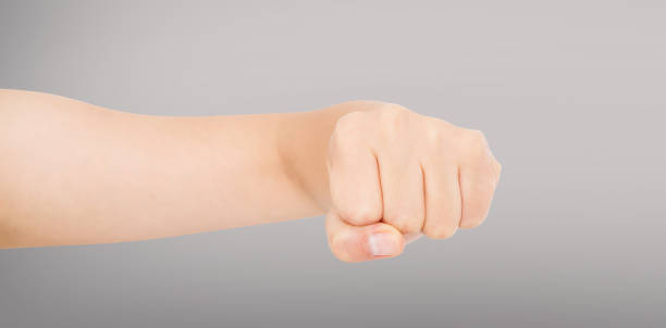istock Woman fist isolated on a grey background. Front view. 1219057421