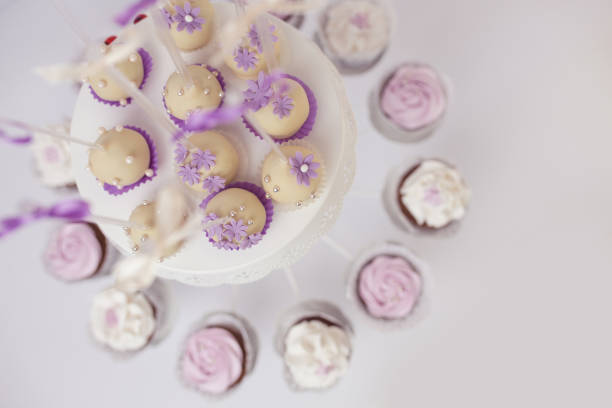 Muffins and cake pops on table for birthday party