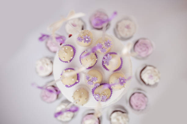 Muffins and cake pops on table for birthday party