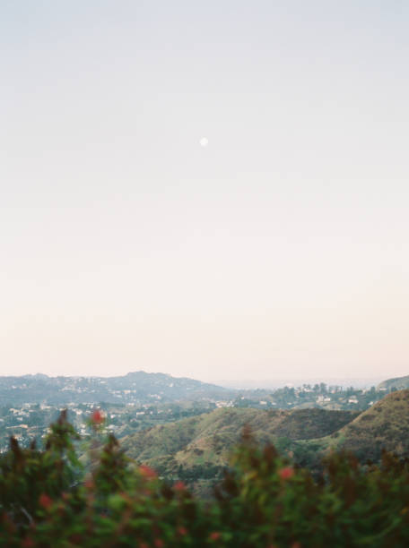 istock Moon at Sunrise over Los Angeles Pastel Colored Sky 1219060193