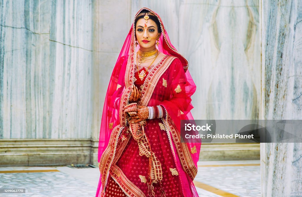 Portrait of a woman in a traditional indian outfit Portrait of a woman in a traditional Indian wedding outfit India Stock Photo
