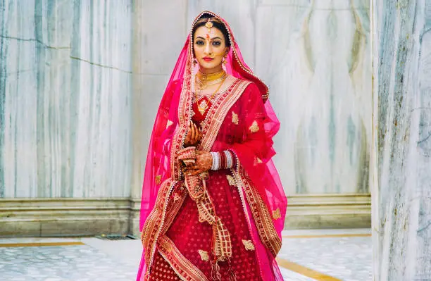 Portrait of a woman in a traditional Indian wedding outfit
