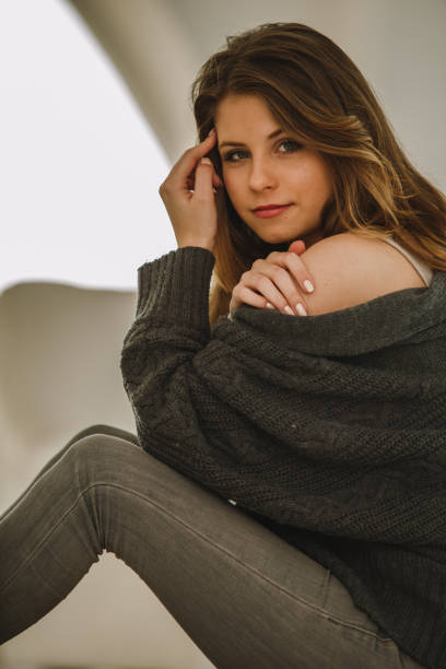 istock Beautiful young woman smiling while looking at camera 1219063663