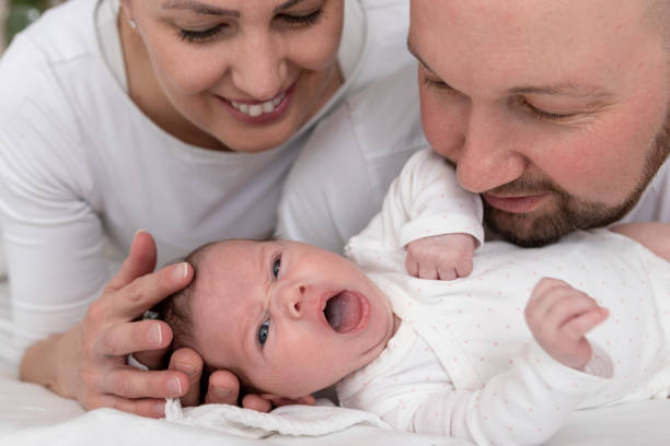 istock Young parents with newborn baby 1219063854
