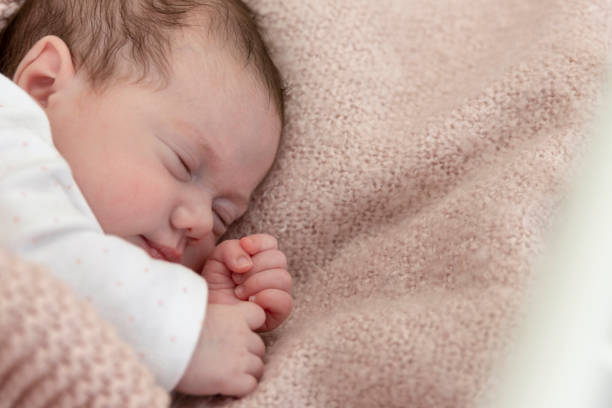 istock Baby girl sleeping in a crib 1219063858