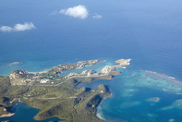 Aerial view of the Devil's Bridge National Park, Dian Bay, Pineapple Beach Club and Long Bay on the North East coast of Antigua in the Caribbean Sea.