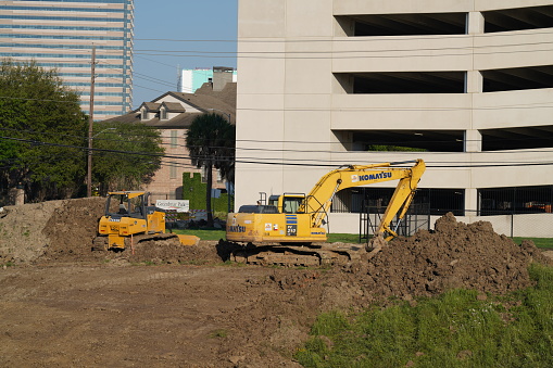 Houston, Texas, USA – April 10, 2020: Views of heavy equipment used by construction workers.  Construction work is considered essential and must continue during the pandemic.