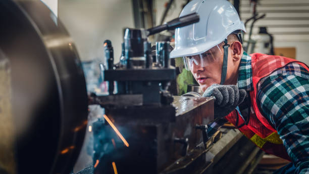 istock industrial background of caucasian mechanics engineer operating lathe machine for metalwork in metal work factory 1219074416